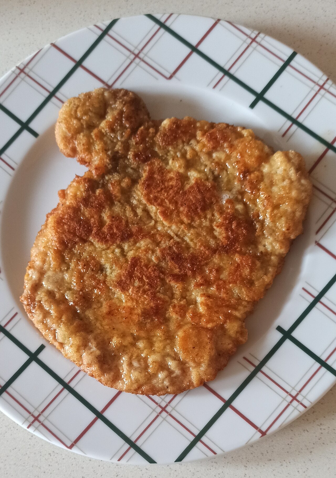 A golden breaded pork cutlet, kotlet schabowy